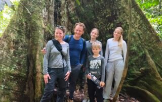 Posing infront of a big tree in the sumatra jungle